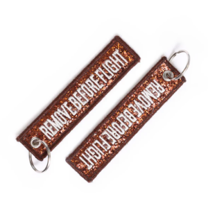 Llavero Glitter "Remove Before Flight"